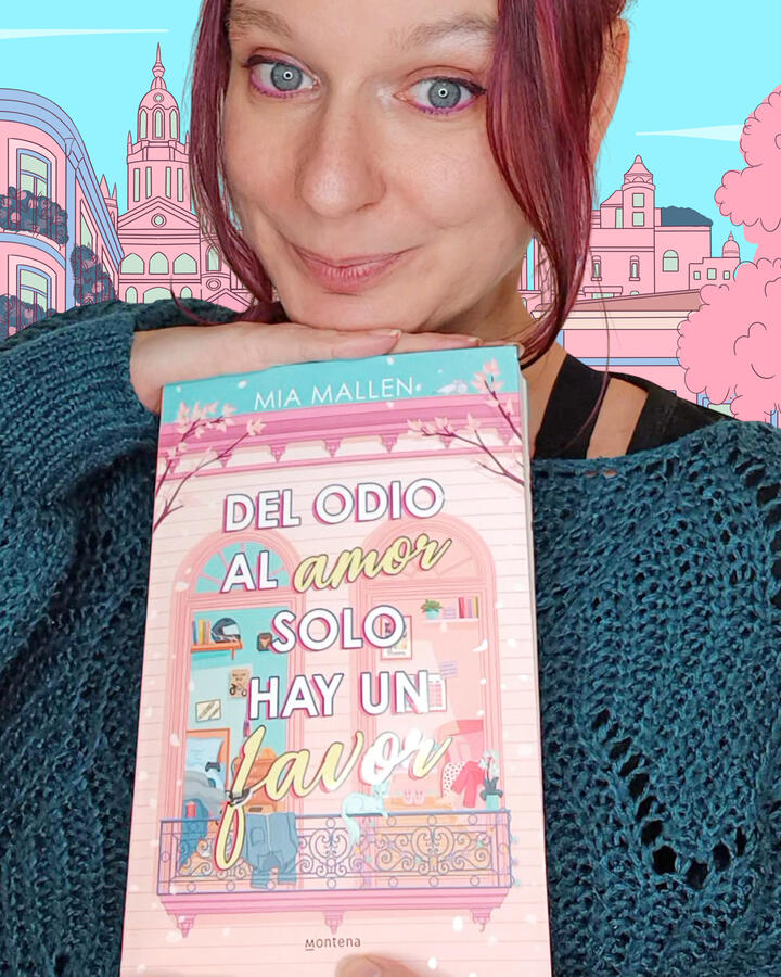 Amélia Bazière, illustratrice, pose avec le roman de Mia Mallen dont elle a créé la couverture.